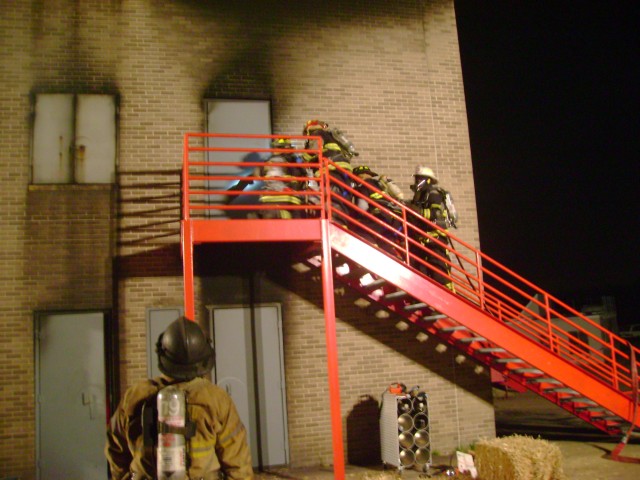 MCFA Live Burn 10/07 - The hose team prepares to enter the structure